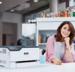Xerox C230 colour printer in a bright office setting, supplied by D&O Partners, demonstrating the ease of use and efficiency of the device in a contemporary working environment.